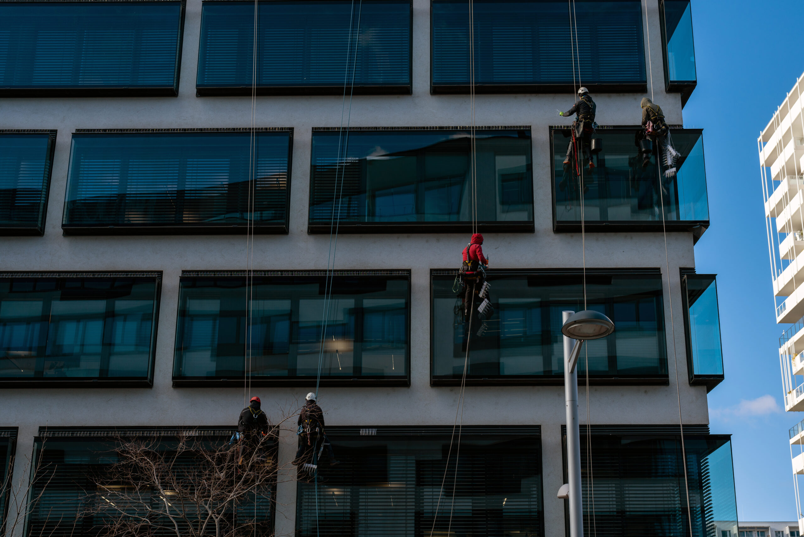 Technician using rope access on a building